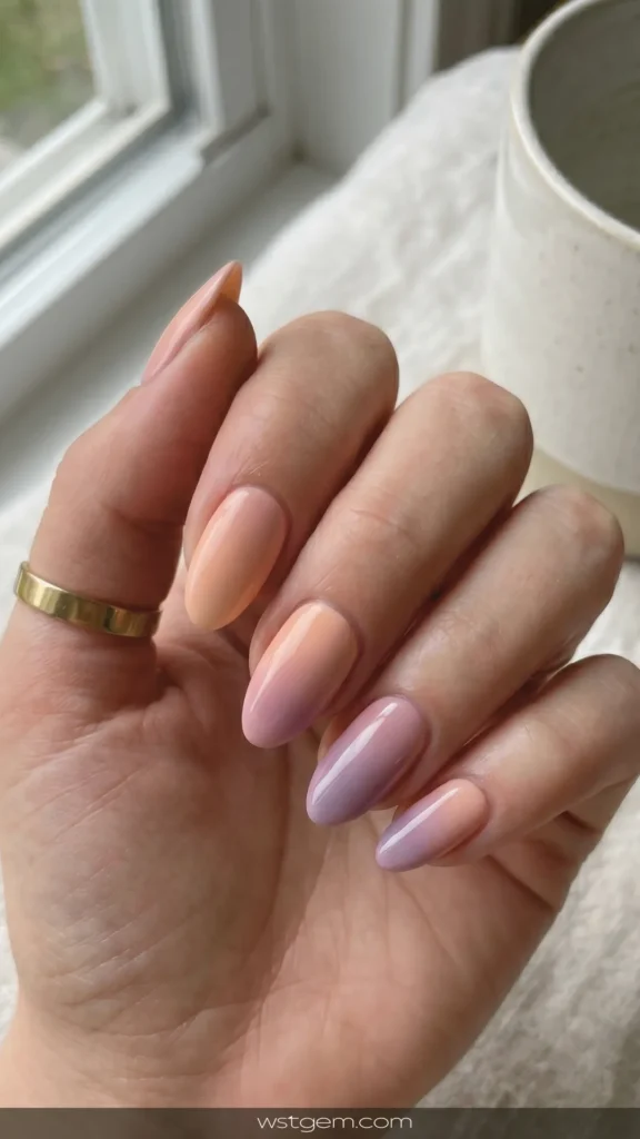 Desert sunset ombré - peach to dusty purple fading across your nails.